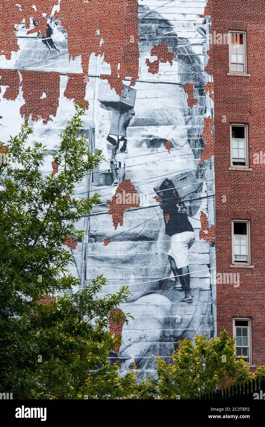 A painting decorates one of the buildings in the East Village. The East Village is located east of downtown Manhattan, surrounded by 14th Street to th Stock Photo