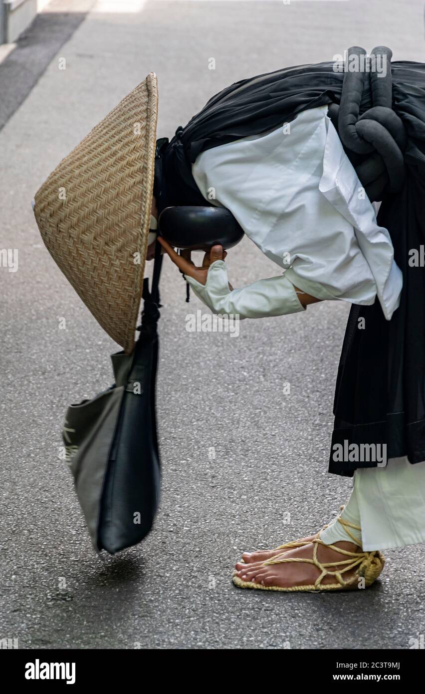 Typical Shinto monk at a street market in Japan Stock Photo