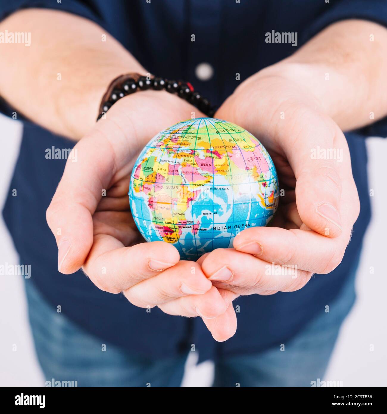Woman holding globe on hands hi-res stock photography and images - Alamy