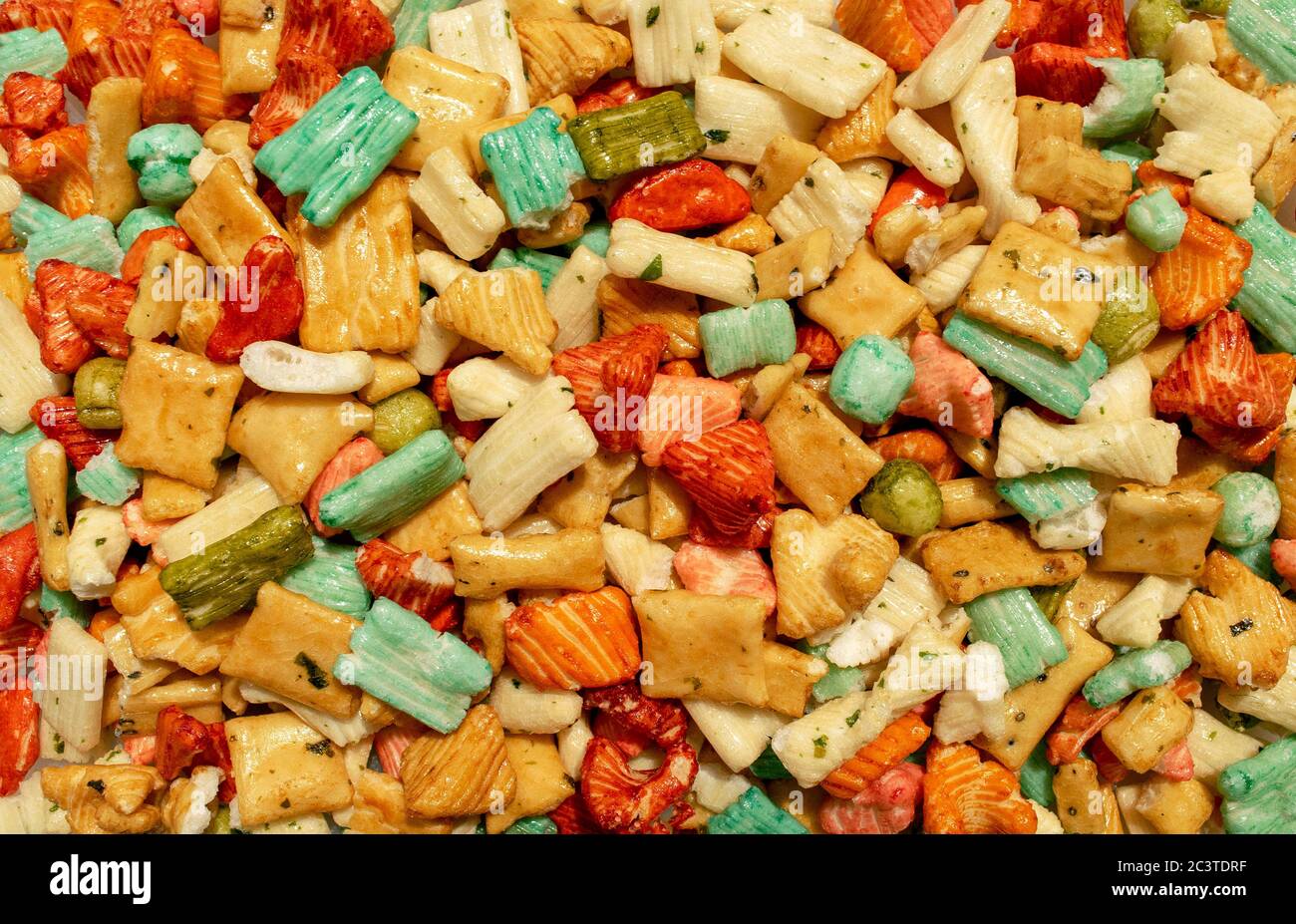 Background made of traditional colorful Tokyo mix or Japan mix. Japanese rice crackers backdrop. Top view. Stock Photo