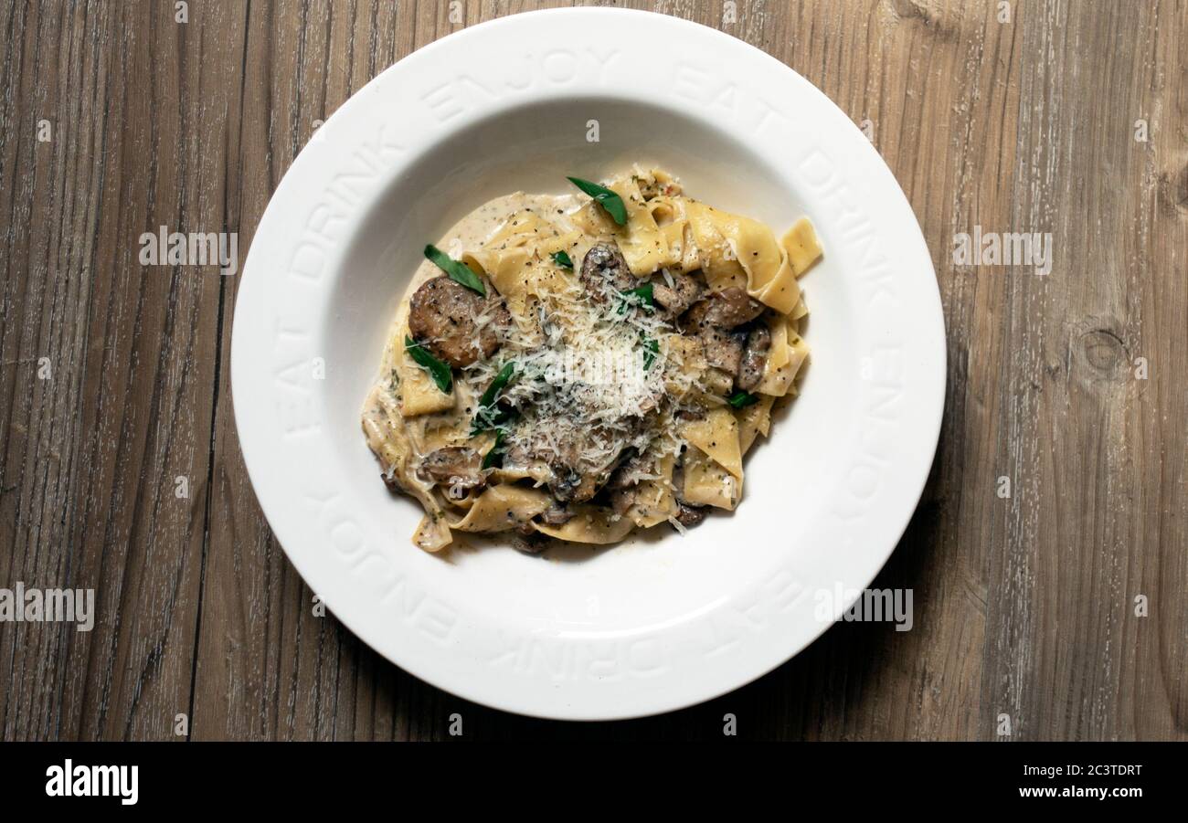 Pappardelle pasta in a creamy mushroom sauce Stock Photo Alamy