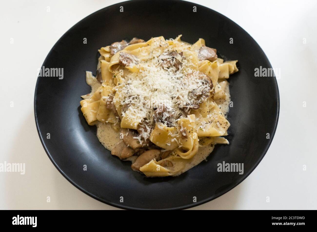 Pappardelle pasta in a mushroom cream sauce Stock Photo Alamy