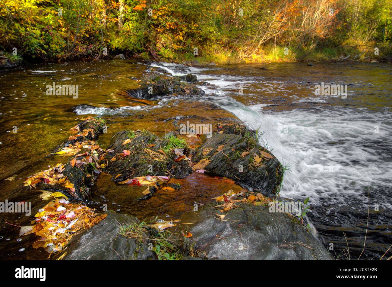 Fall Color Landscape. Waterfall along the Falls River in Baraga, Michigan. Stock Photo