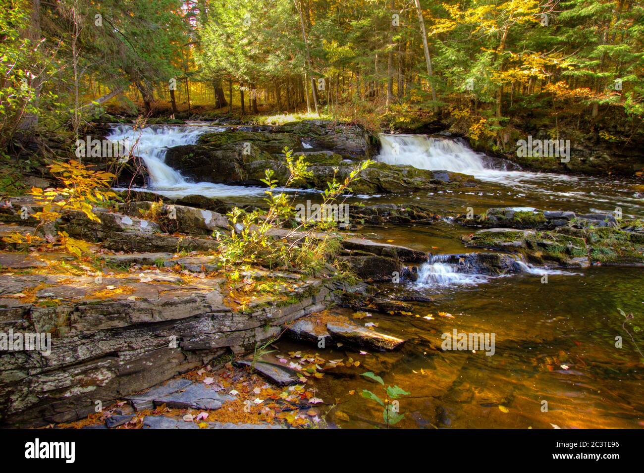 Double Waterfall with fall foliage on the Falls River in the small town of L'Anse in the Upper Peninsula of Michigan. Stock Photo