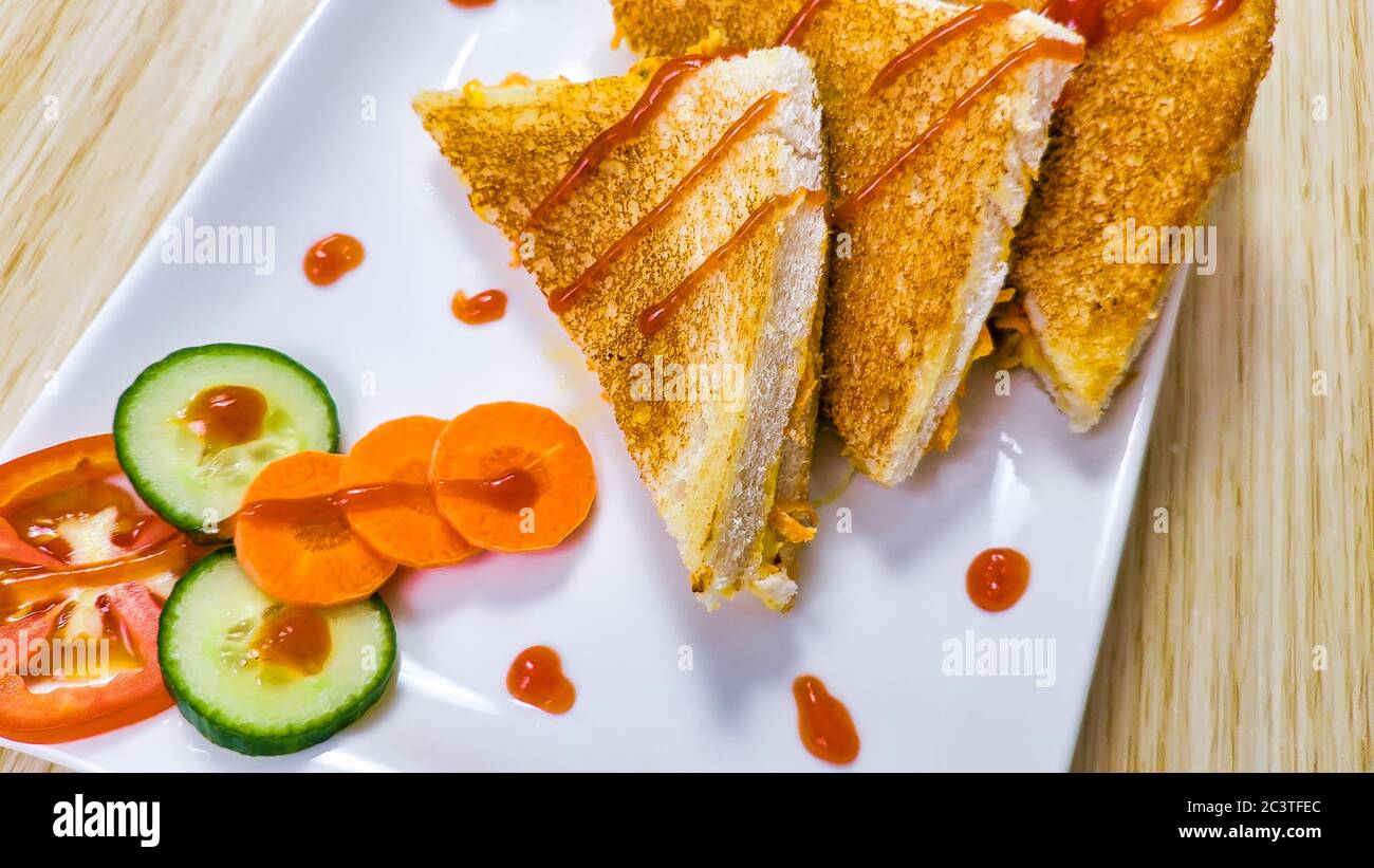 Closeup of vegetable toast sandwiches garnished with ketchup. Stock Photo