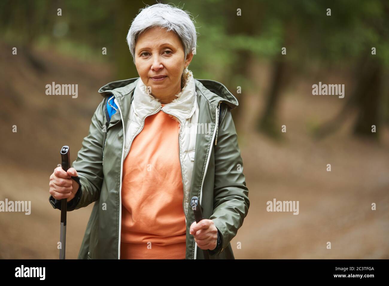 Mature woman nordic walking autumn hi-res stock photography and images ...