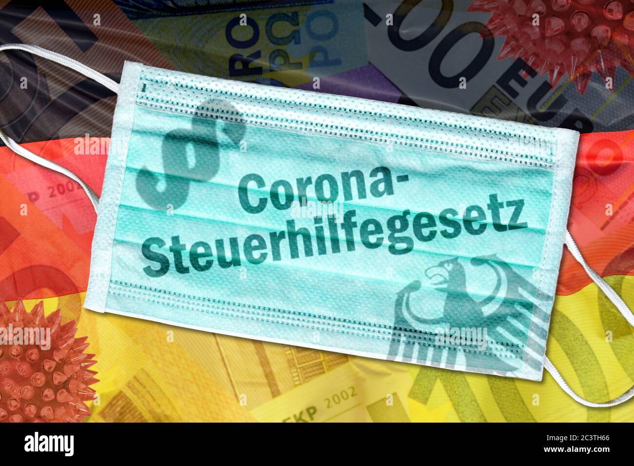 PHOTOMONTAGE, mouth guard with inscription corona Tax Act on Germany flag, FOTOMONTAGE, Mundschutz mit Aufschrift Corona-Steuergesetz auf Deutschlandf Stock Photo