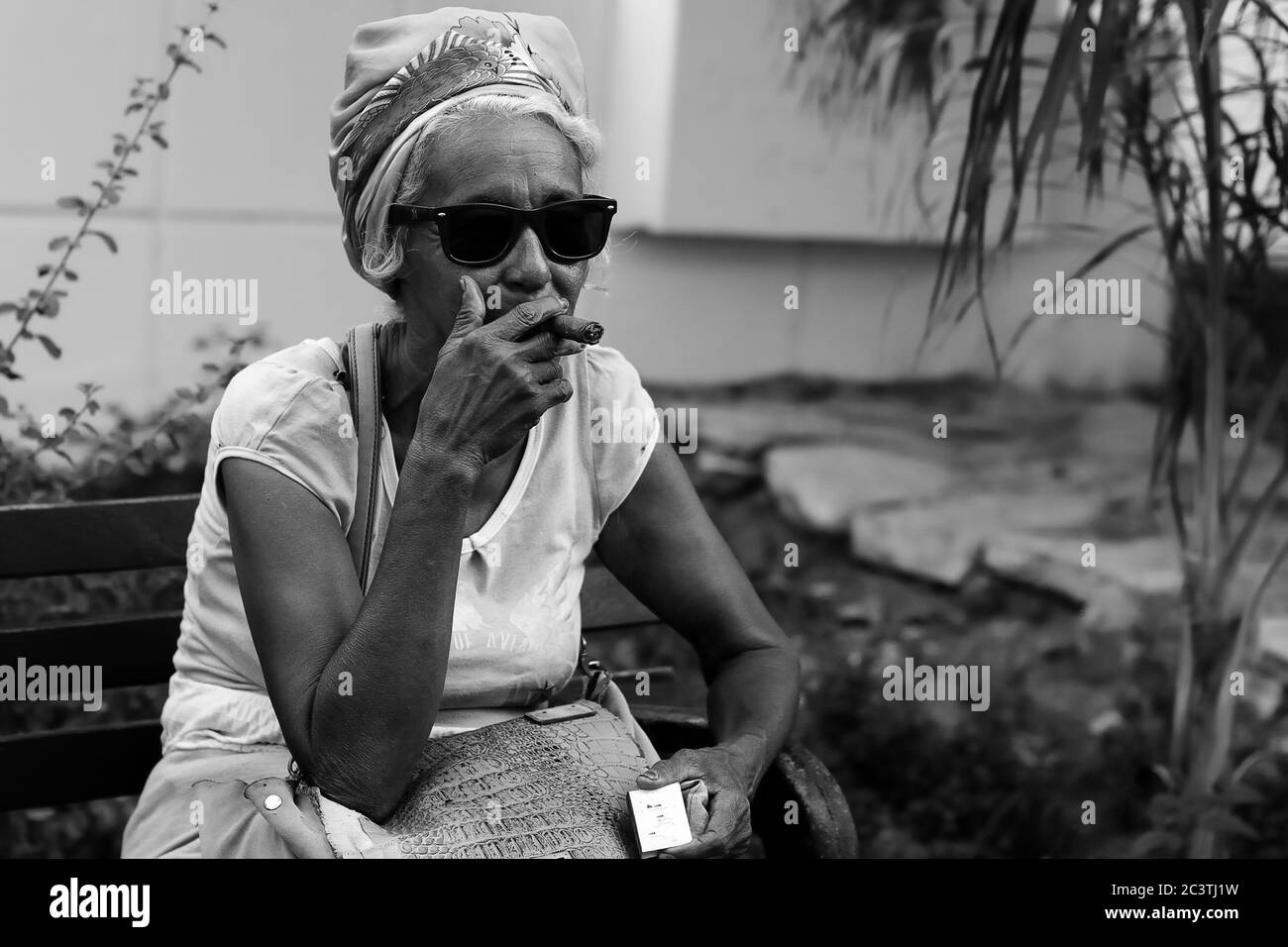 SANTIAGO DE CUBA, CUBA - NOVEMBER 29: The Cuban is smoking the cigar in Santiago de Cuba on November 29, 2016 Stock Photo