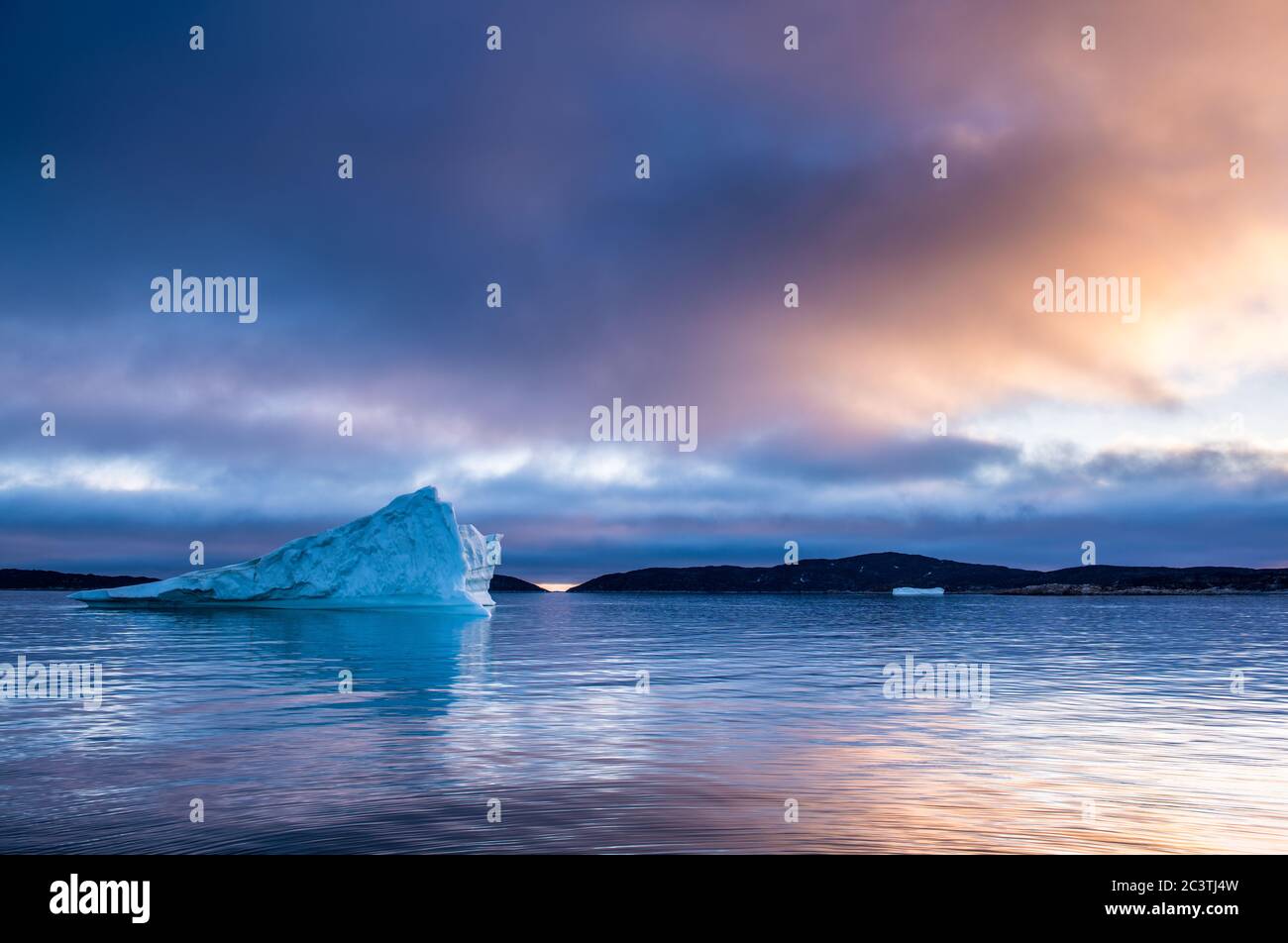 Iceberg at sunset in the Disco Bay, Greenland. Their source is by the Jakobshavn glacier. Stock Photo