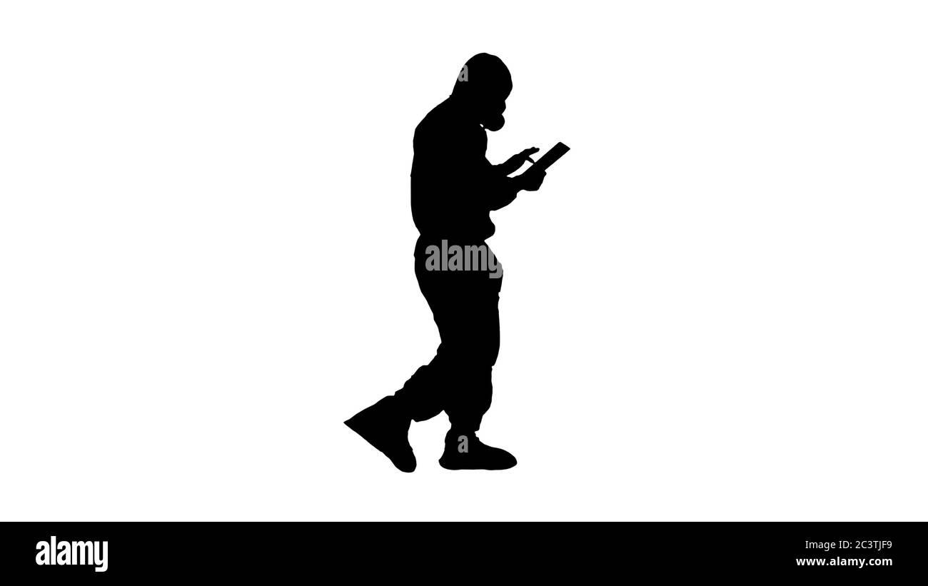 Silhouette Scientist or docrot wearing biohazard suits and protective masks using digital tablet while walking. Stock Photo