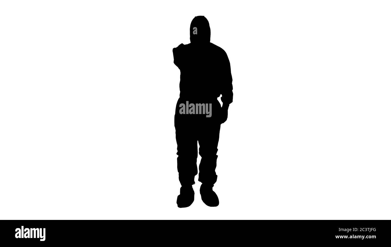 Silhouette Doctor in protective biohazard suit points laser thermometer to check your temperature at a covid19 checkpoint. Stock Photo