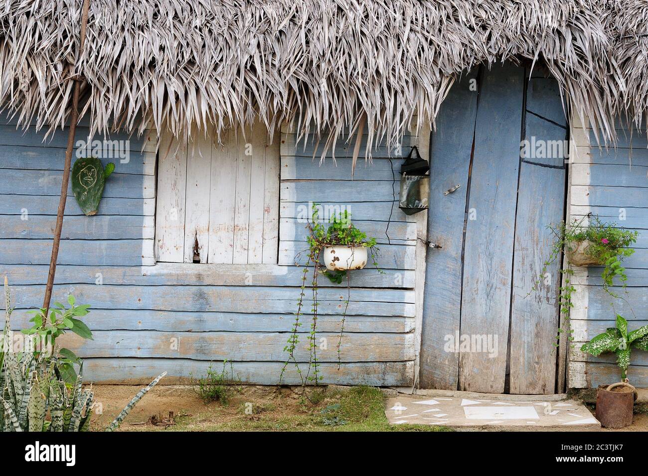 Thatched roof building at the base of the Mountain in the Village, in Cuba Stock Photo