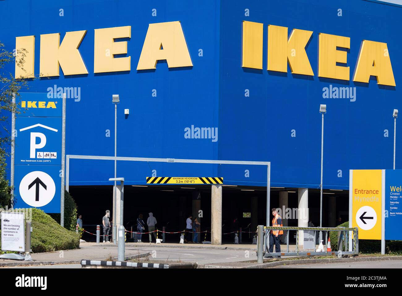 Cardiff, Wales, UK. 22nd June, 2020. A parking attendant and queuing  shoppers as the Cardiff Ikea store reopens after the coronavirus lockdown.  Credit: Mark Hawkins/Alamy Live News Stock Photo - Alamy