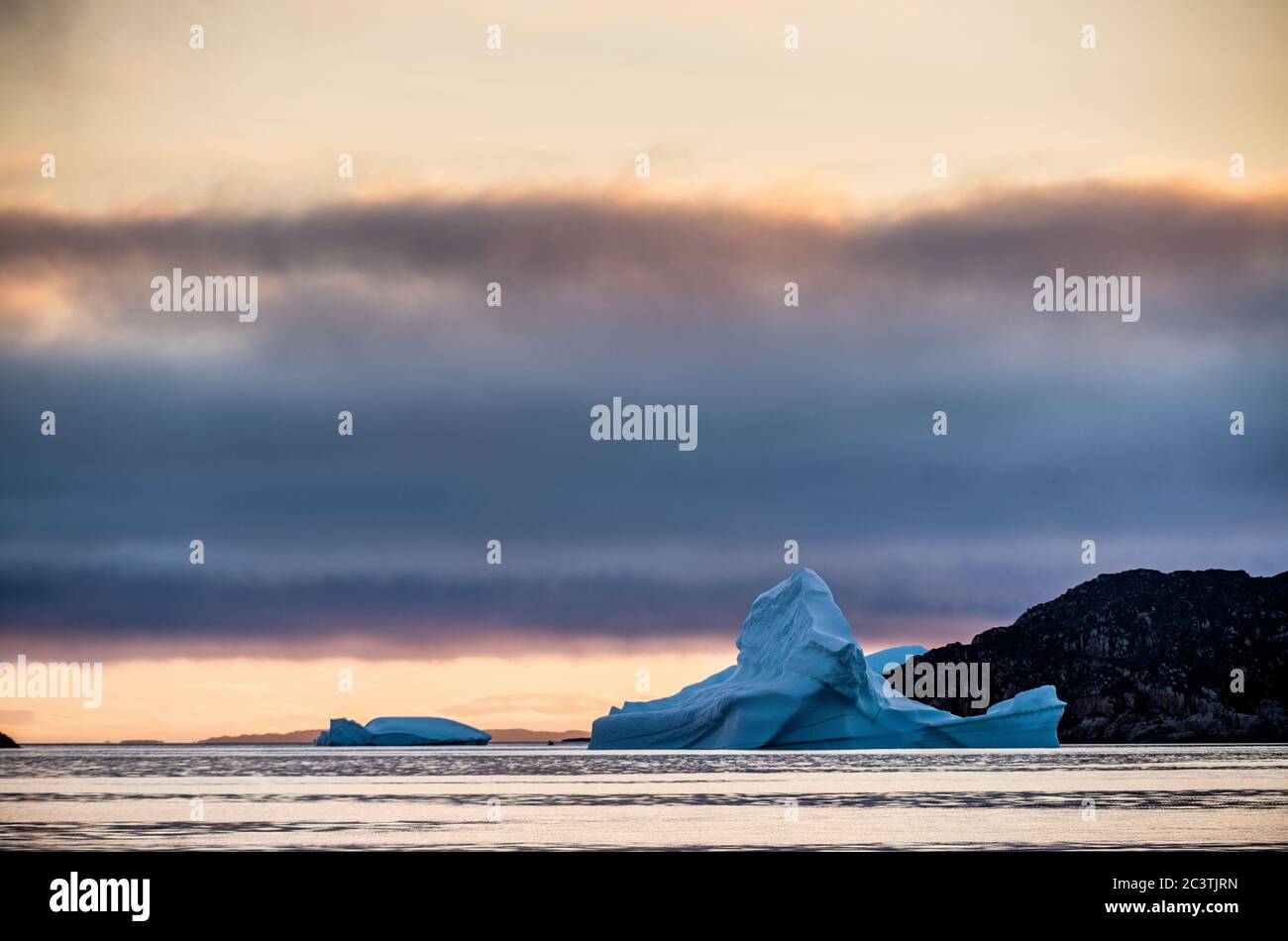 Iceberg at sunset in the Disco Bay, Greenland. Their source is by the Jakobshavn glacier. Stock Photo