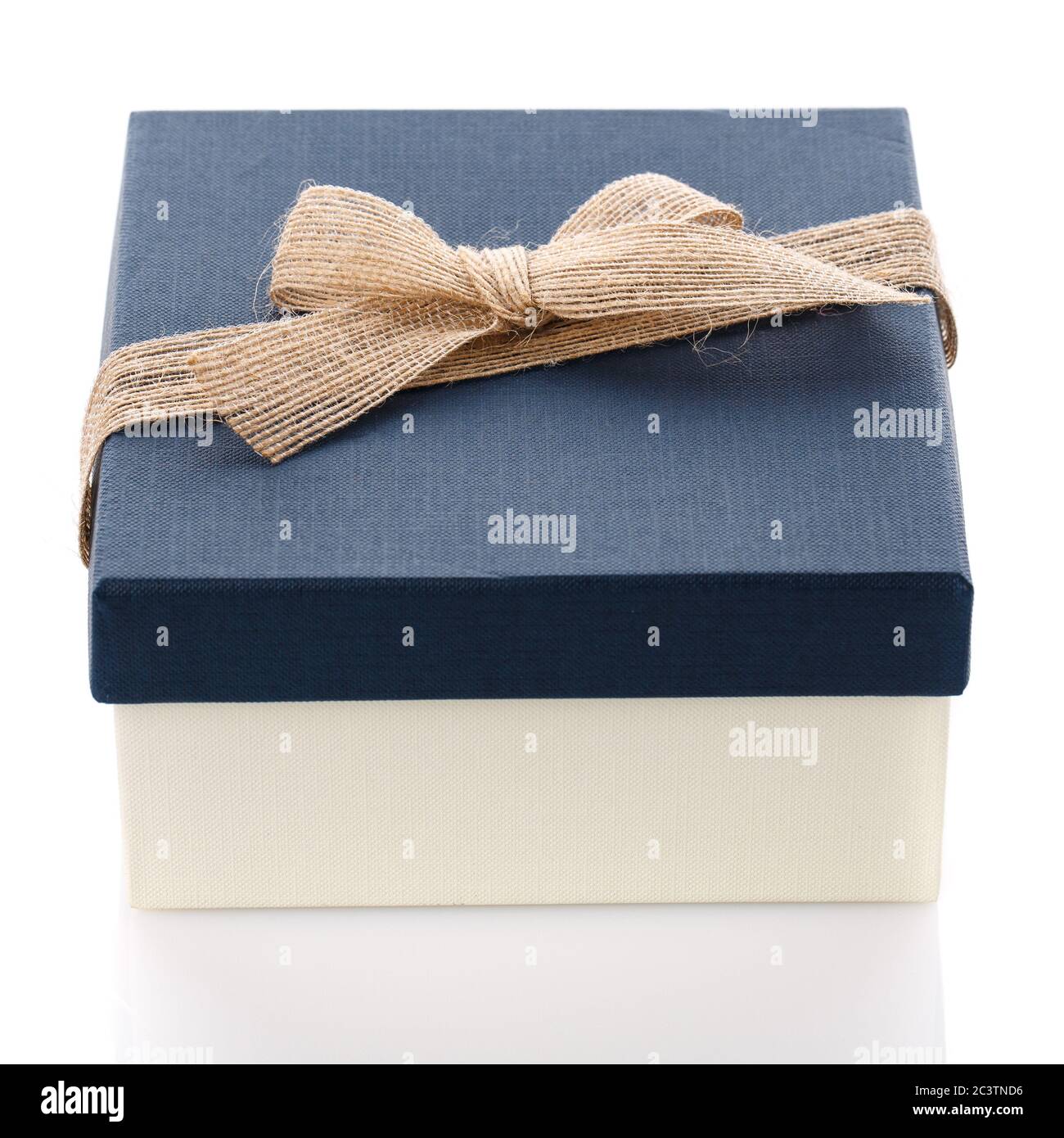 Cardboard box on a white background. Gift box with sacking ribbon. Stock Photo