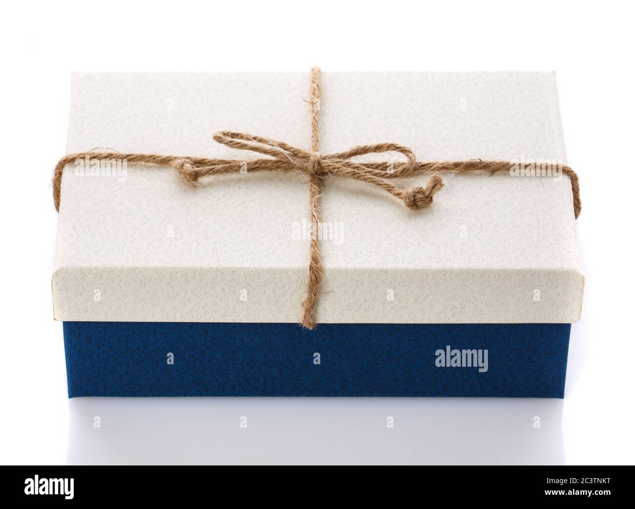 Cardboard box on a white background. Gift box with sacking ribbon. Stock Photo