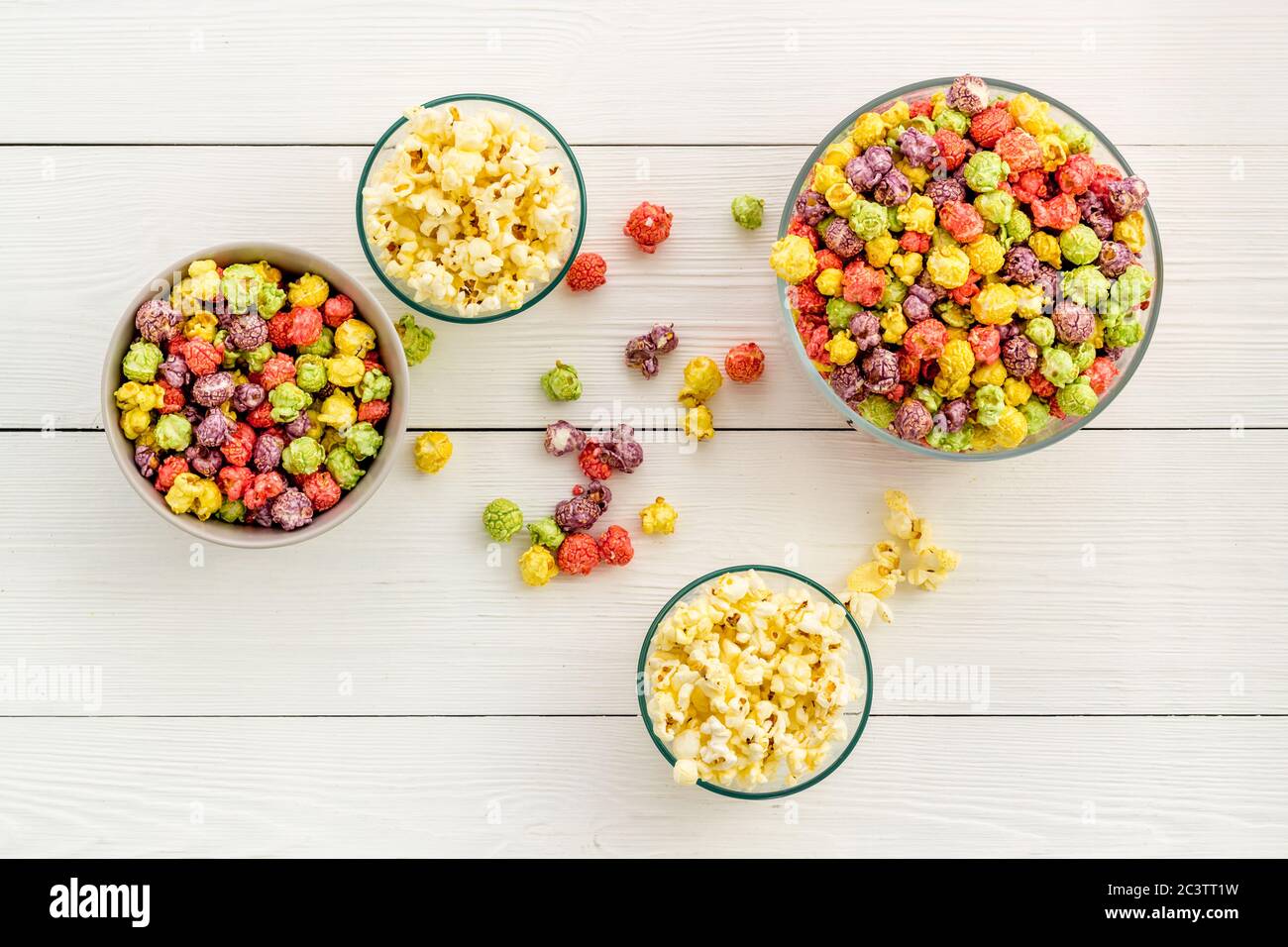 Flavored popcorn on white background top view Stock Photo