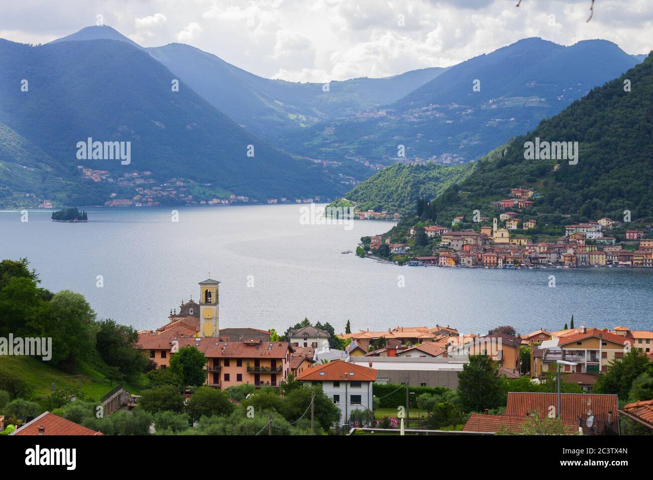 Aerial view of lake Iseo, Lombardy, Italy. On the foreground the town of Sulzano Stock Photo