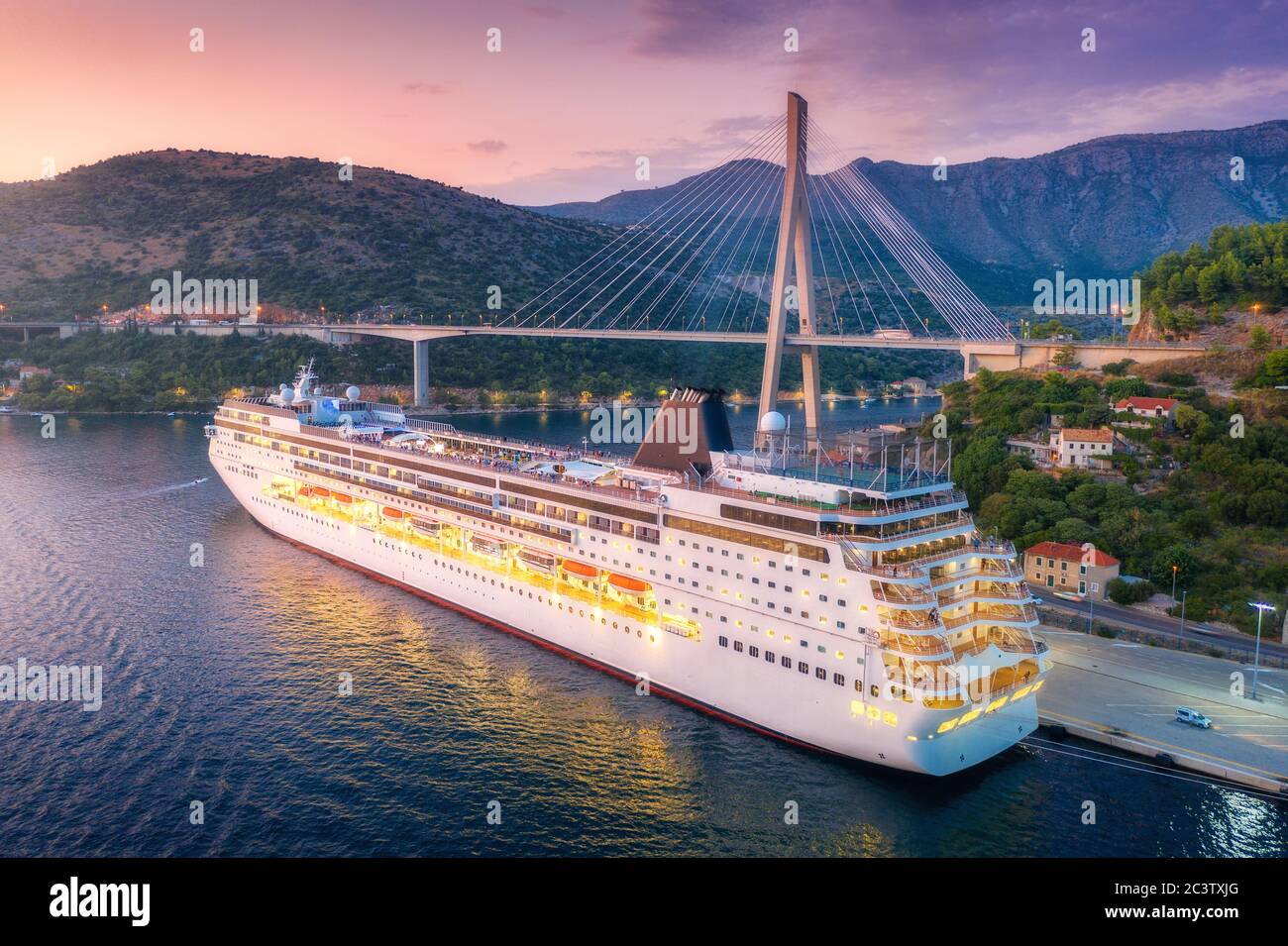 Aerial view of cruise ship and beautiful bridge at night Stock Photo ...