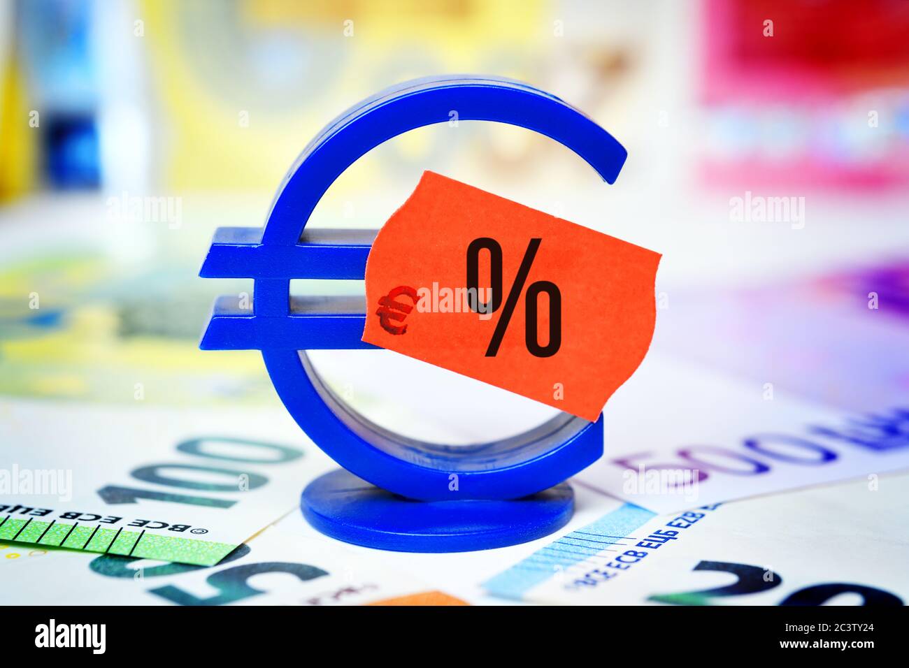 PHOTOMONTAGE, euro sign with price tag and percent sign, symbol photo for reduced value added tax to stimulate the economy, FOTOMONTAGE, Eurozeichen m Stock Photo