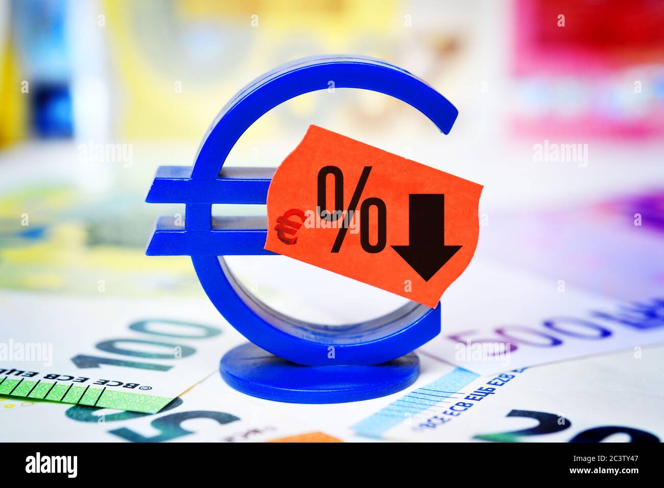PHOTOMONTAGE, euro sign with price tag and percent sign, symbol photo for reduced value added tax to stimulate the economy, FOTOMONTAGE, Eurozeichen m Stock Photo