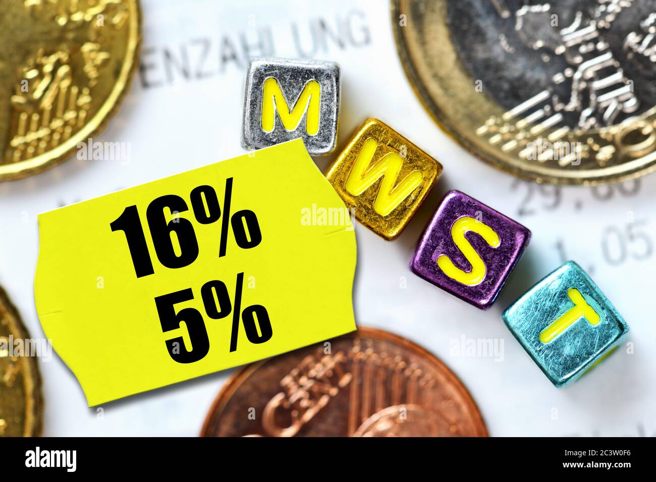 PHOTOMONTAGE, Lowered VAT rates on a price tag, FOTOMONTAGE, Abgesenkte Mehrwertsteuersätze auf einem Preisetikett Stock Photo