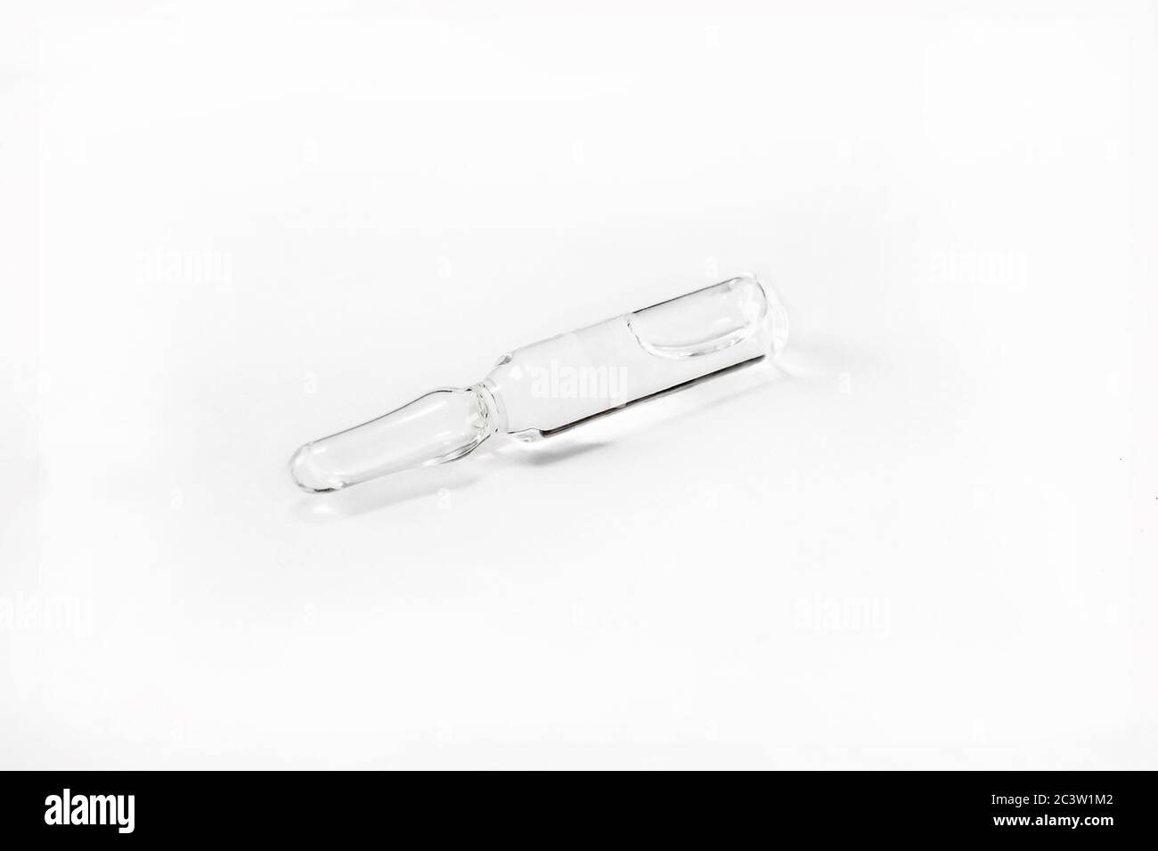 Glass medical ampoule vial for injection isolated on white background