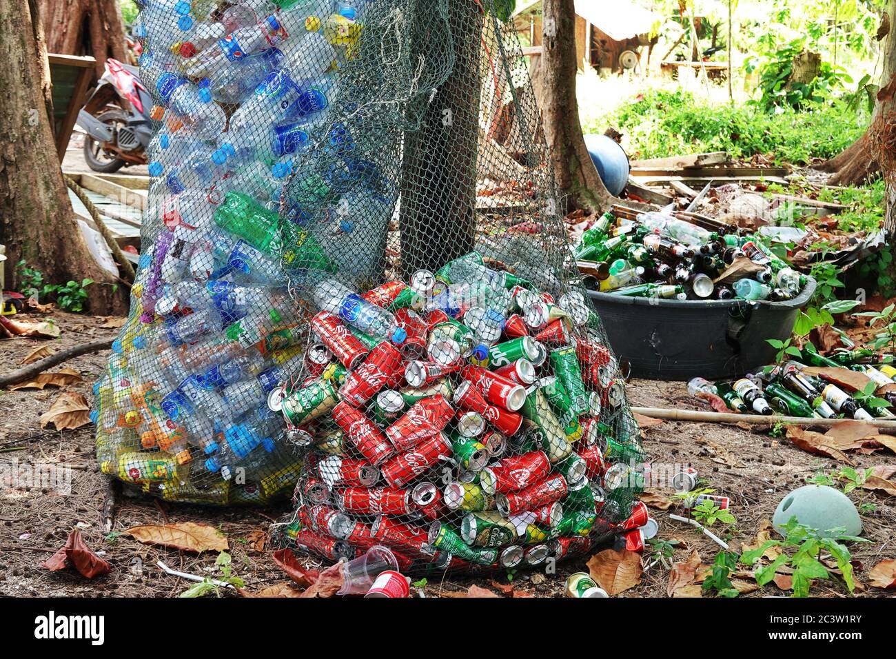 Ko Mak, Thailand. 27th Oct, 2019. Nets with empty beverage cans and plastic water bottles are lying in a forest near the beach. The island is about 16 square kilometers and is located in the eastern Gulf of Thailand near the border with Cambodia. As tourism on the island is not yet very developed, there are only a few resorts or bungalows. Credit: Soeren Stache/dpa-Zentralbild/ZB/dpa/Alamy Live News Stock Photo