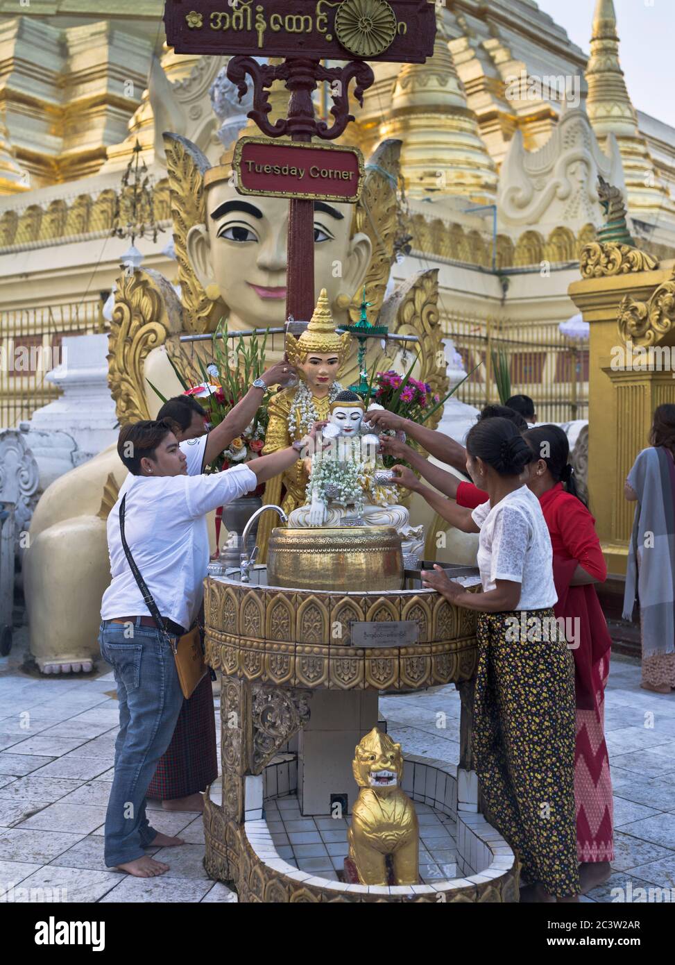 dh Shwedagon Pagoda temple YANGON MYANMAR Burmese local people washing buddha ritual Great Dagon asia traditional cultural religious rituals Stock Photo