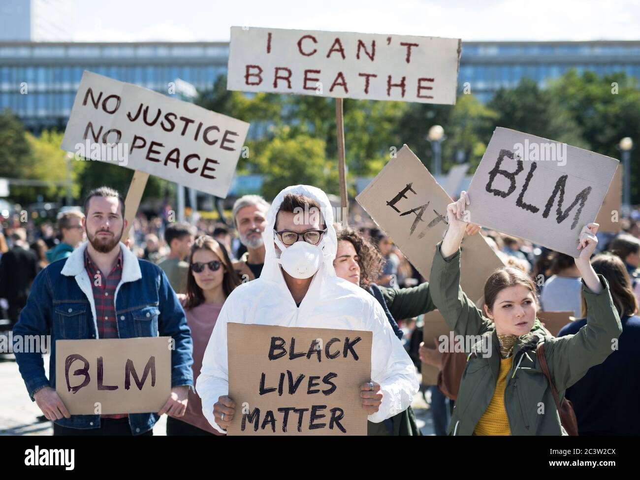 Protesters With Signs Black lives matters protesters holding signs and marching outdoors in ...
