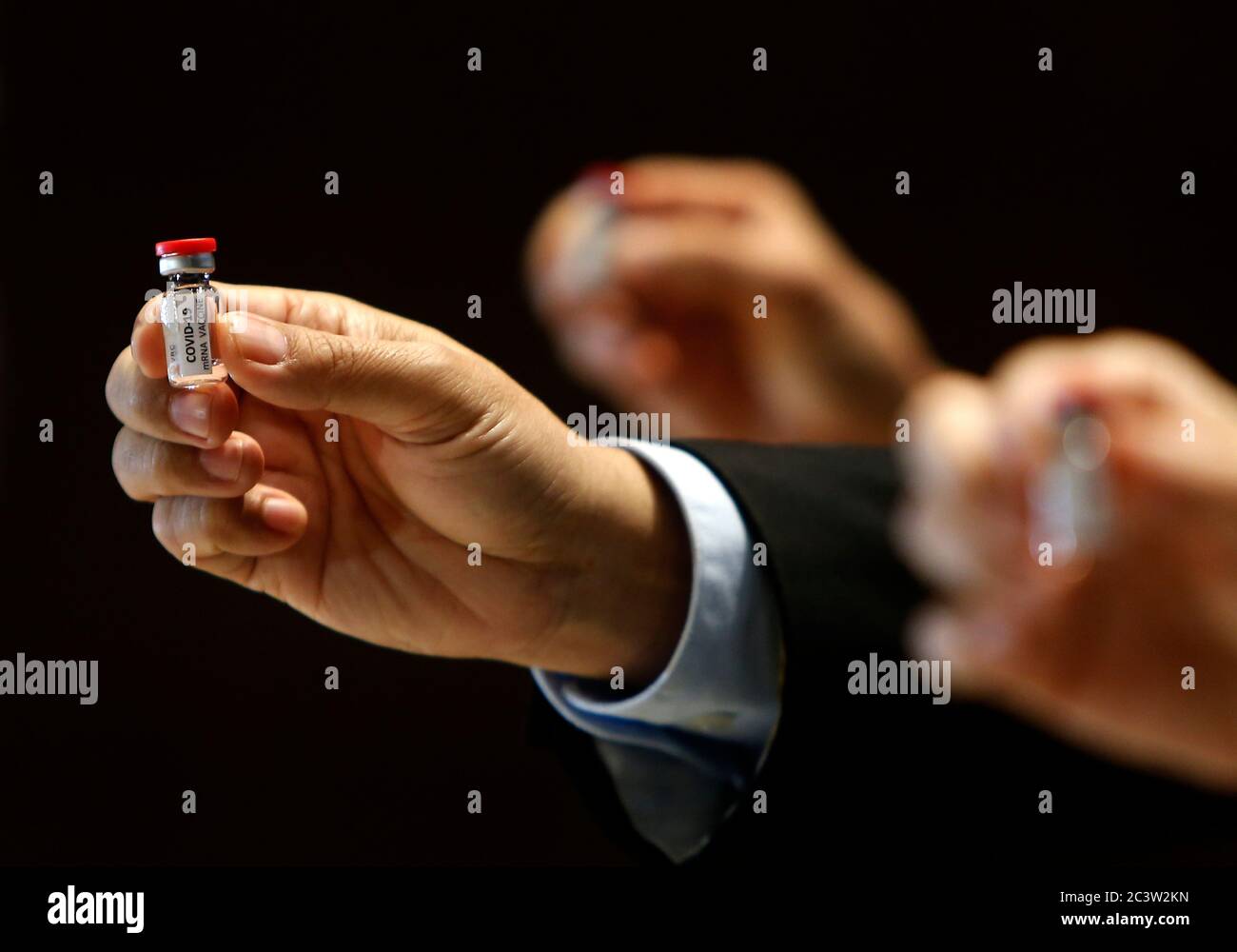 Saraburi, Thailand. 22nd June, 2020. Researchers hold a COVID-19 mRNA vaccine during a news conference at the National Primate Research Center of Chulalongkorn University.Some vaccine candidates are in early stage of development, but 2 candidate vaccines are already in animal evaluation. The mRNA vaccine developed by Chulalongkorn University has proceeded through evaluation in mouse and then in Monkey. Second dose in Monkey is given on June 22, 2020. Credit: SOPA Images Limited/Alamy Live News Stock Photo