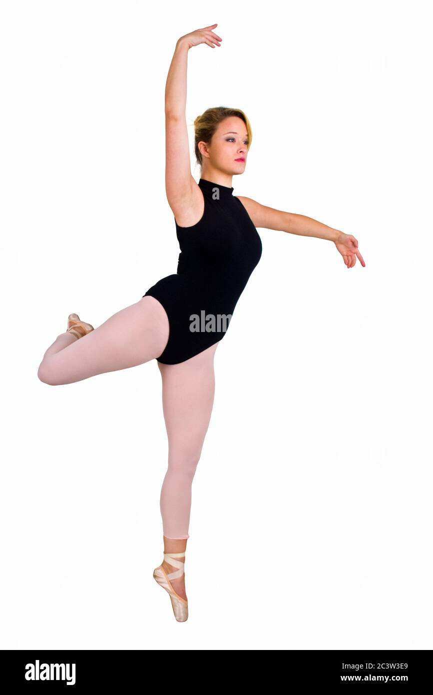 Female blond Ballet Dancer balances on her toes Stock Photo
