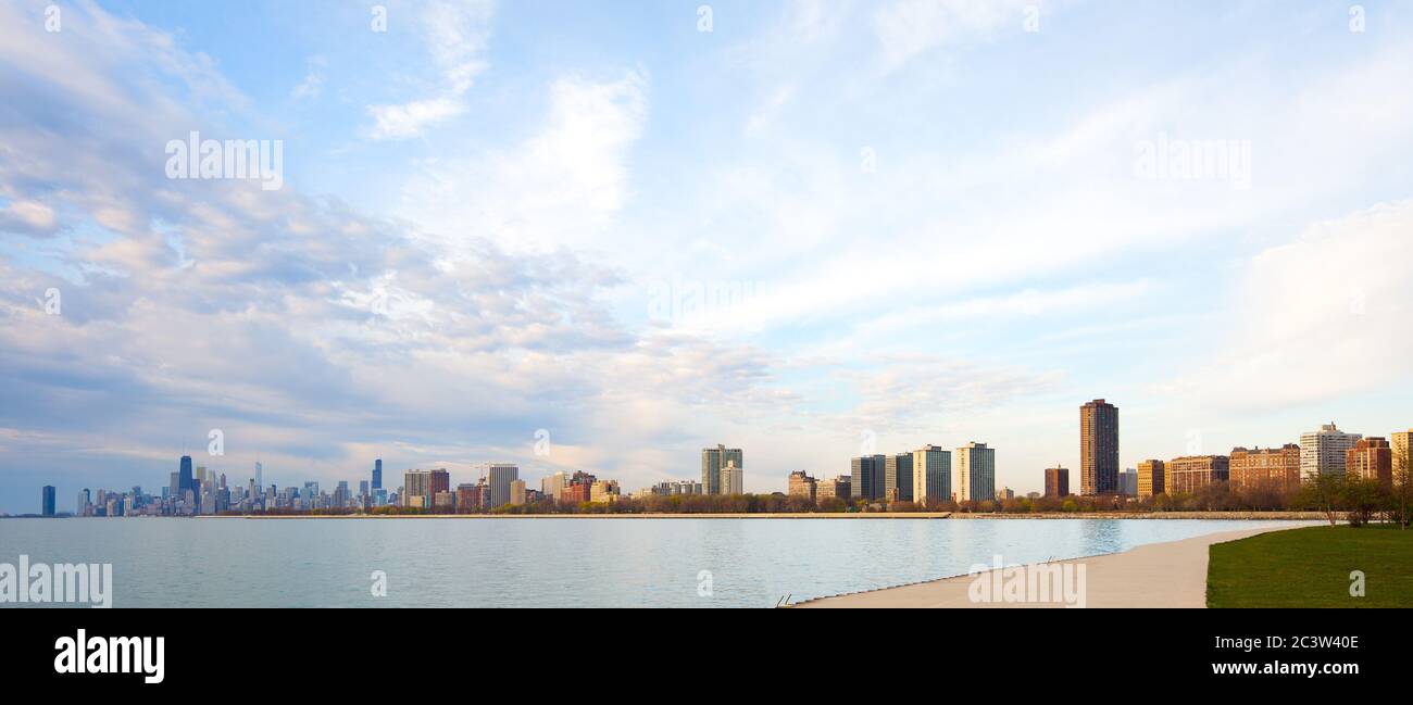 Apartment buildings in the waterfront of Montrose Harbor and downtown city skyline of Chicago at dawn, Illinois, United States. Stock Photo