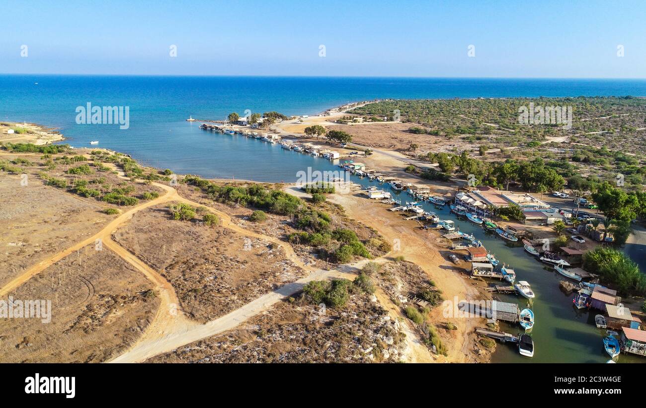 Aerial bird's eye view of Liopetri river to the sea (potamos Liopetriou), Famagusta, Cyprus. A tourist attraction fishing village, natural fjord Stock Photo