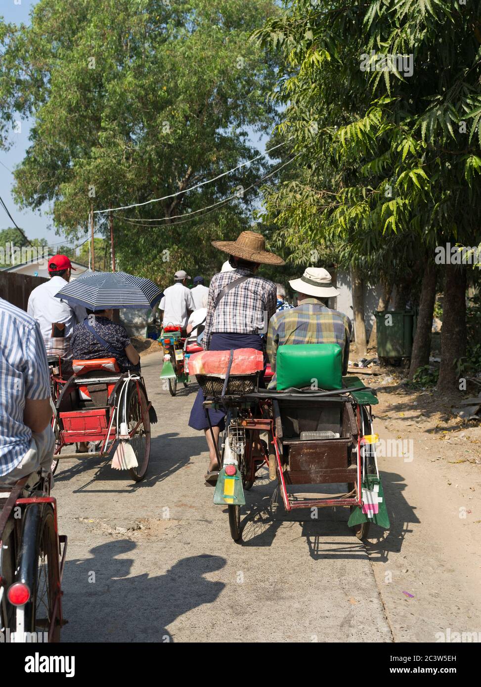 dh Thanlyin Burma Rangoon YANGON MYANMAR Tourists local Burmese trishaw ride sightseeing tourist tour people holiday Stock Photo