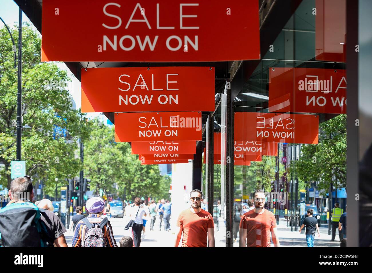 London, UK.  22 June 2020.  Sale signs on a department store on Oxford Street.  The UK government has recently relaxed coronavirus lockdown restrictions allowing non-essential shops to reopen.  It is hoped that the pent-up demand by consumers will lift the retail economy.  At the same time, retailers have been sitting on a large amount of unsold inventory during lockdown, so sale signs are on display to attract shoppers. Credit: Stephen Chung / Alamy Live News Stock Photo