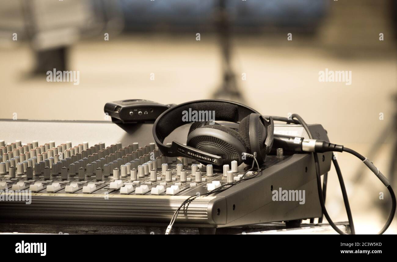 Mixing desk and headphones at outdoor live gig Stock Photo