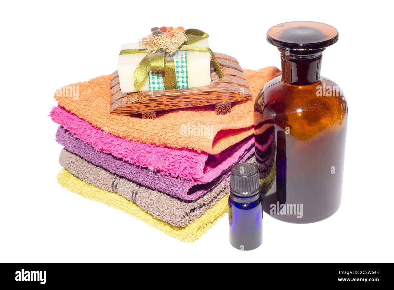 soap on top of facecloths of various shades with bottles Stock Photo