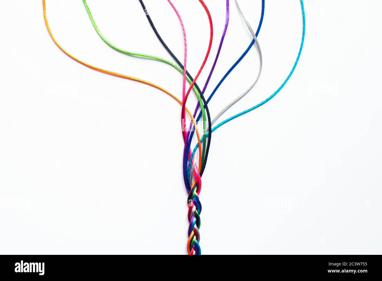 Coloured String Woven Together To Illustrate Concepts Of Unity Society Togetherness and Cooperation Stock Photo