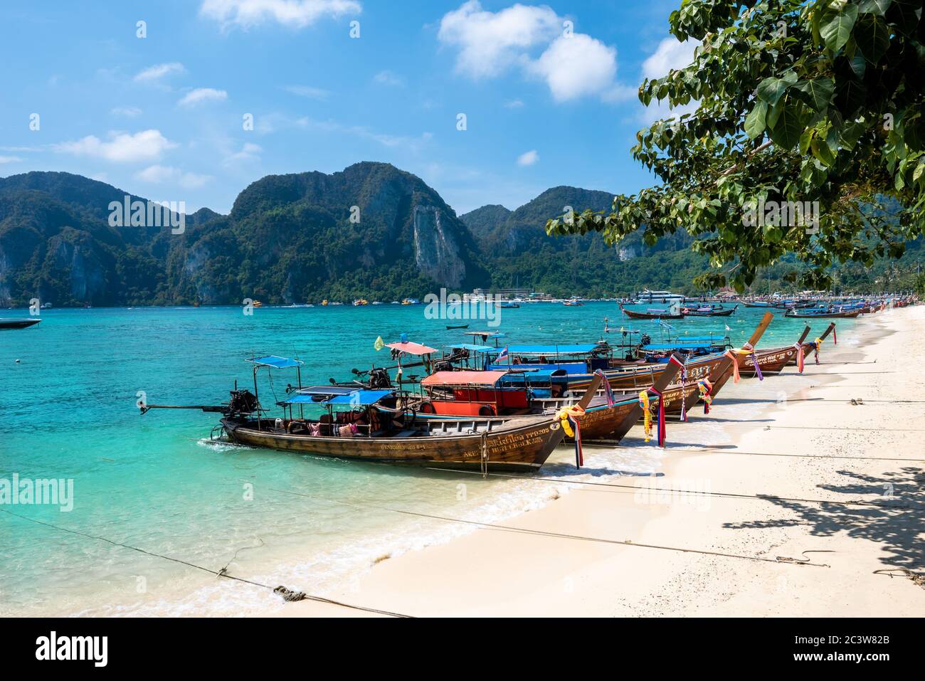 Ton Sai Bay, Thailand - Ianuary18, 2018:  Traditional longtail boats on the seaport  and beach on a sunny day in Thai region Stock Photo