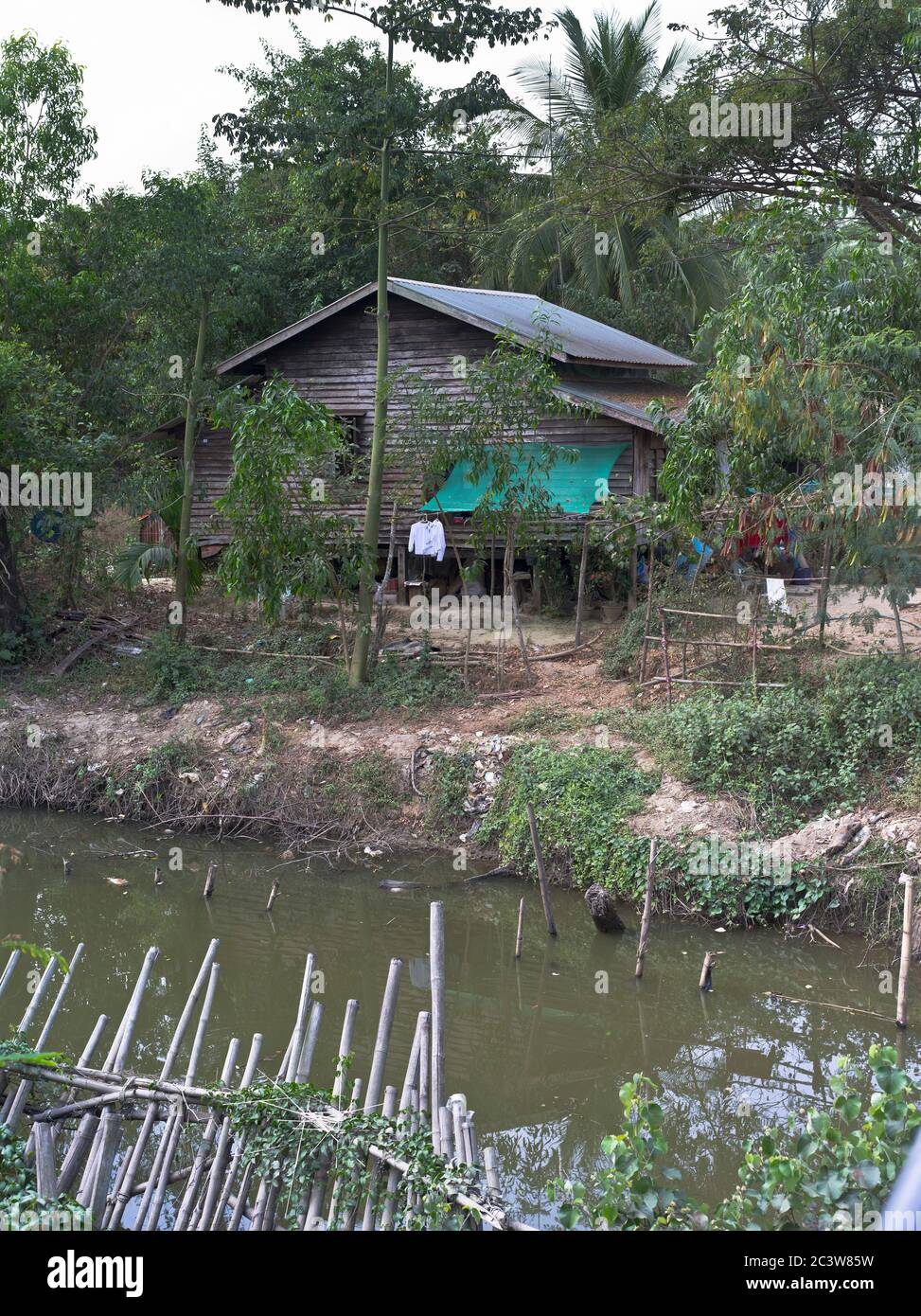 dh Burmese village river shack YANGON MYANMAR House hut building burma home Stock Photo