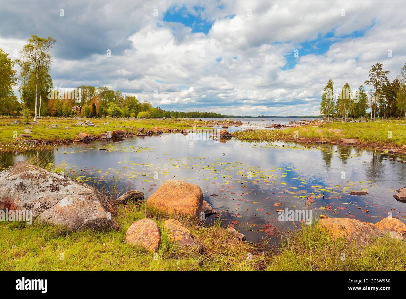Swedish lake with rocks in summer in the province of Smaland Stock Photo