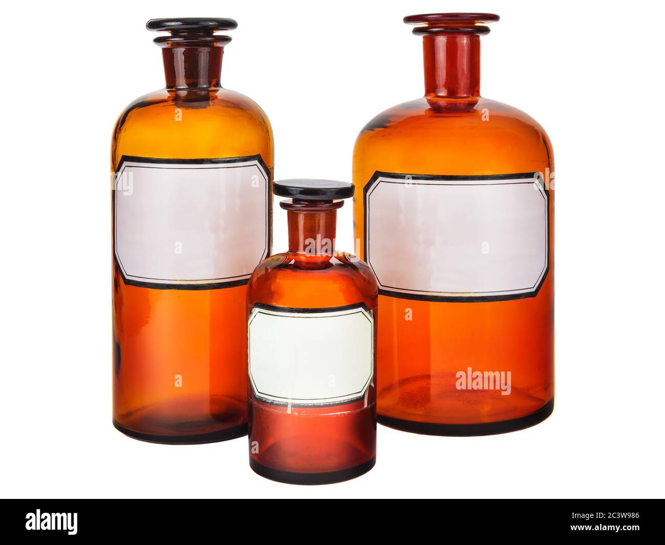 Three vintage pharmacy bottles with blank labels isolated on a white background Stock Photo