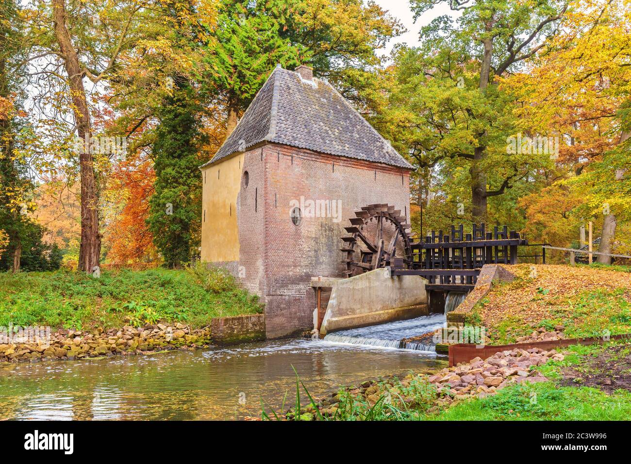 Old water mill in the Dutch province of Gelderland during autumn Stock Photo