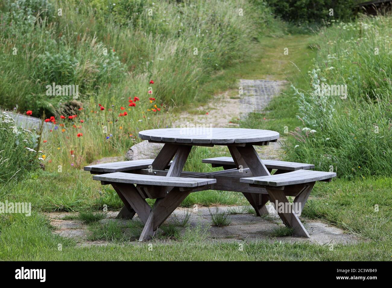 Round Table With Benches And Grass In The Background Stock Photo Alamy