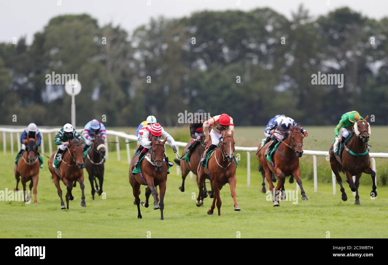 Tarnhelm ridden by Rhona Pindar (red and white cap) on their way to victory in the Every Race Live On RacingTV Handicapin the Watch On RacingTV Handicap at Thirsk Racecourse. Stock Photo