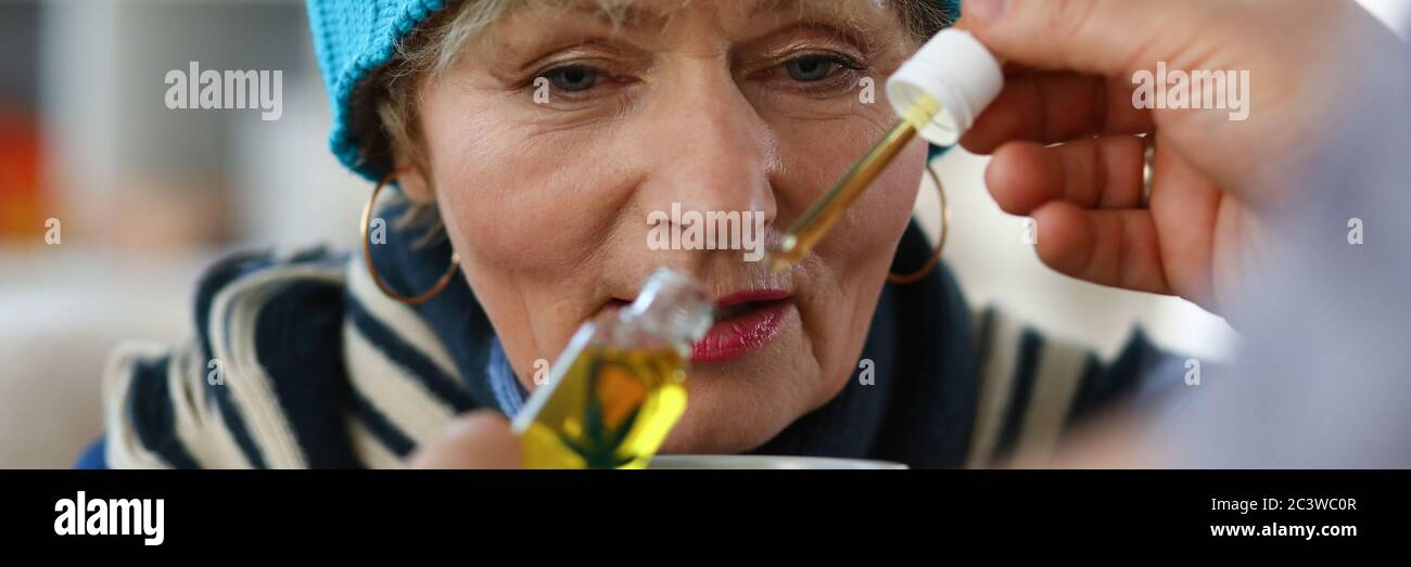 Elderly woman taking hi-res stock photography and images - Alamy