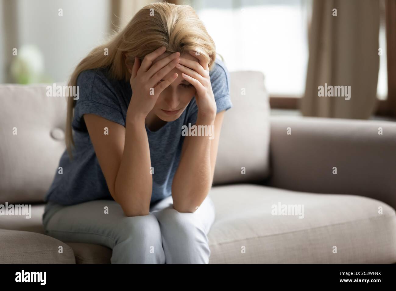 Unhappy woman suffers feels desperate goes through divorce Stock Photo