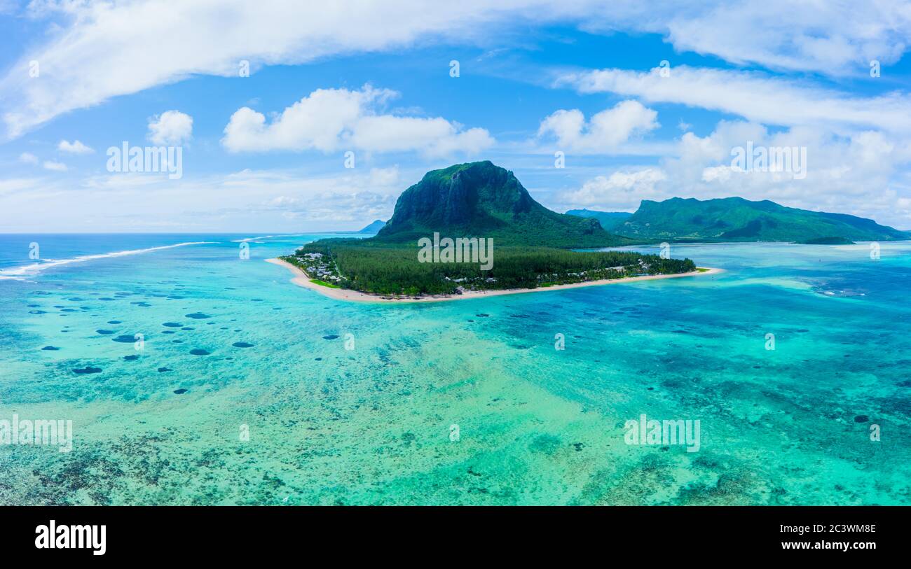 Aerial panoramic view of Mauritius island - Detail of Le Morne Brabant mountain with underwater waterfall perspective optic illusion - Wanderlust and Stock Photo