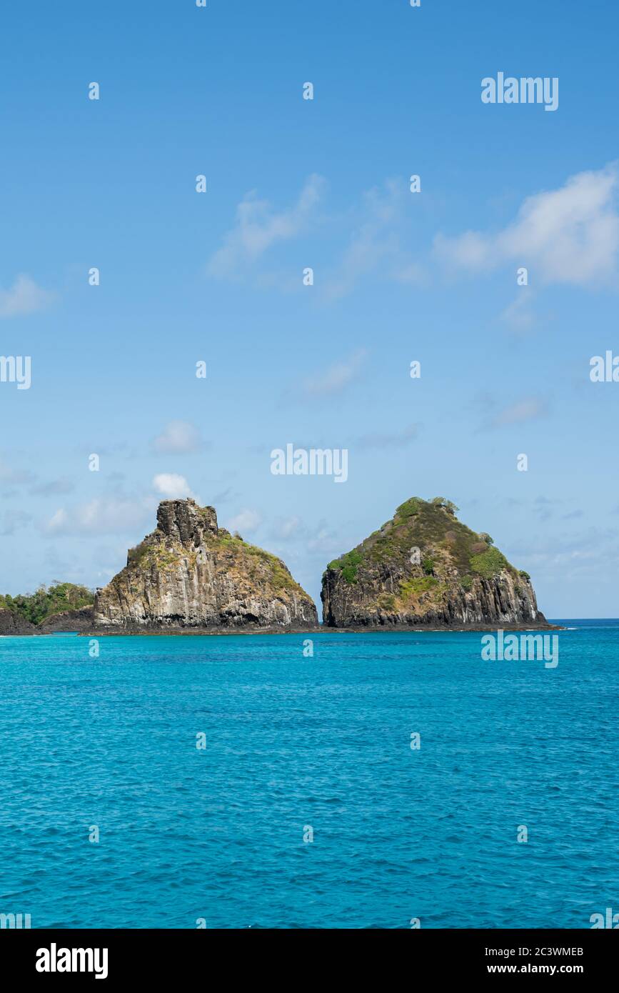 Beautiful background view of Cacimba do Padre beach with Dois Irmaos Hill and turquoise clear water, at Fernando de Noronha, Unesco World Heritage sit Stock Photo